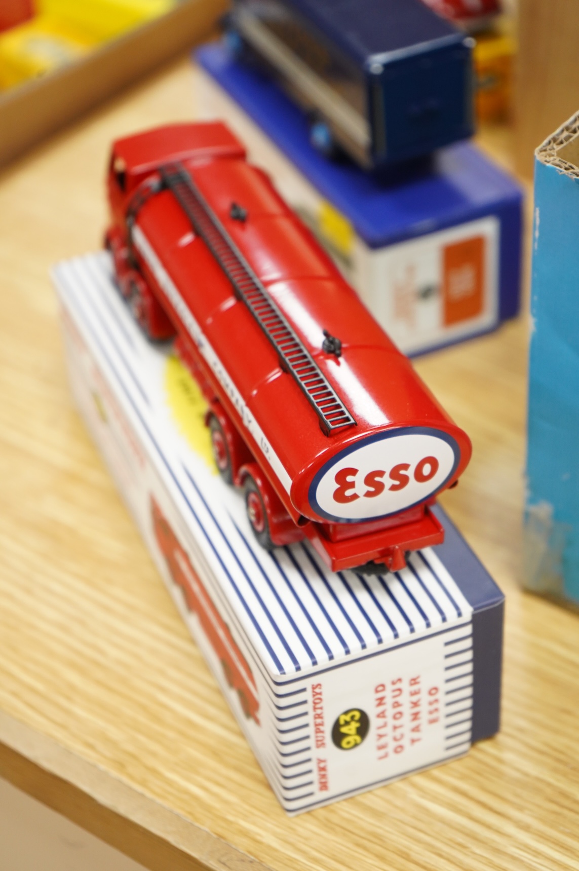 Twenty-two boxed Atlas Dinky Toys, including cars and commercial vehicles, Leyland tankers, a Foden wagon, sports cars, etc.